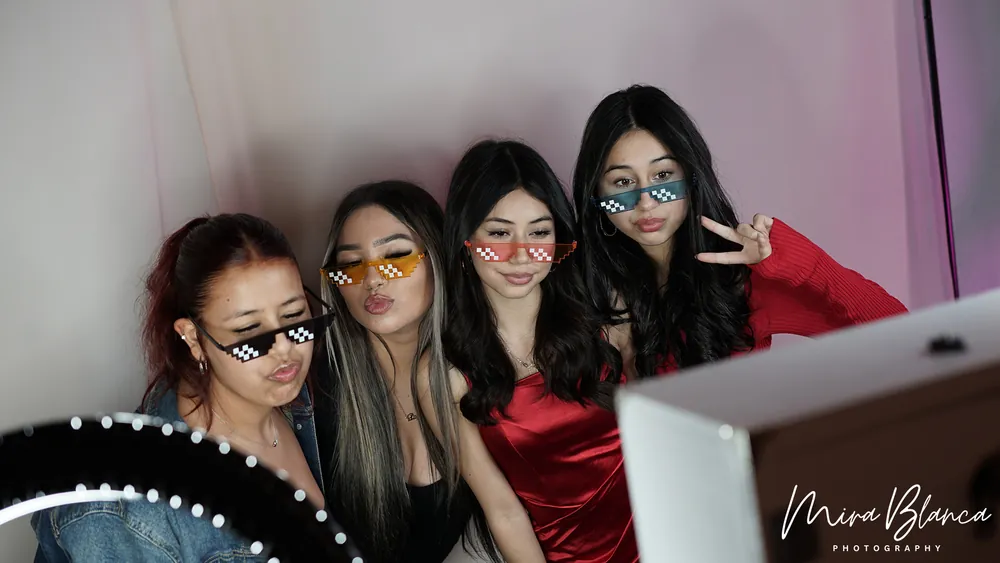 Guests sharing a playful Photo Booth moment