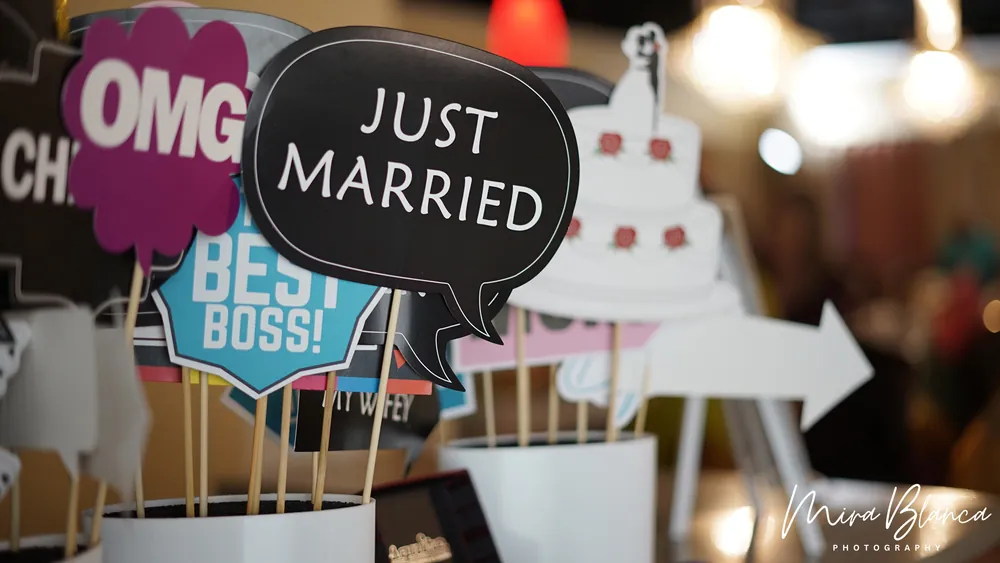 Wedding-themed Photo Booth props on display