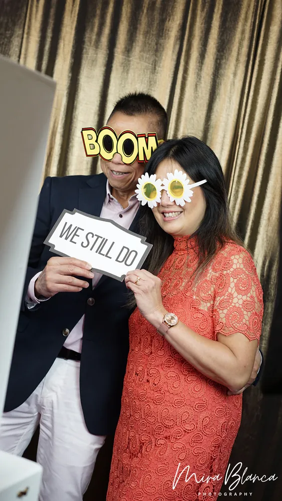 Couple sharing a lighthearted Photo Booth pose