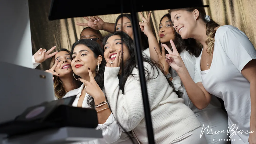 Guests creating a Photo Booth pose at the touchscreen