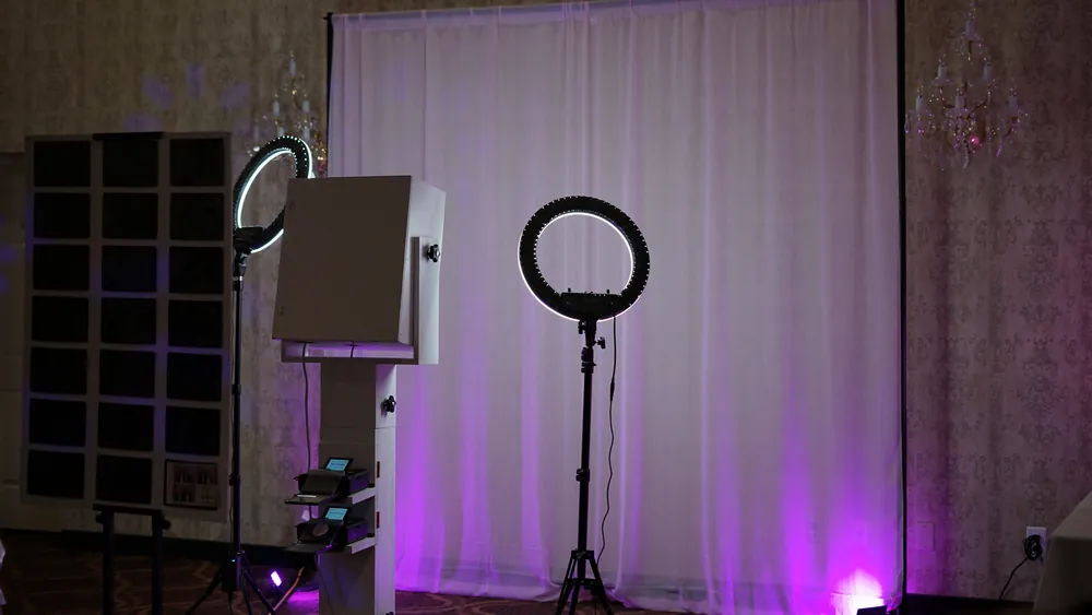 Mira Blanca open-air Photo Booth setup with backdrop and ring light