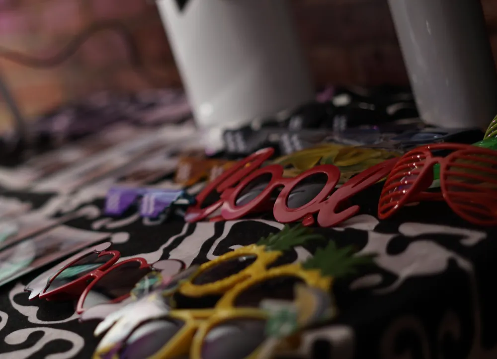 Colorful Photo Booth props arranged at an event